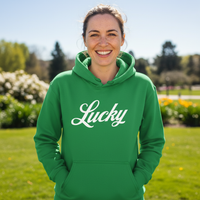 Load image into Gallery viewer, Person wearing a green hoodie with 'Lucky' printed on it, standing outdoors.