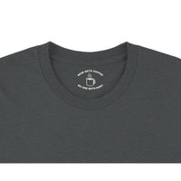 Load image into Gallery viewer, Dark gray t-shirt with a white graphic on the collar against a white background