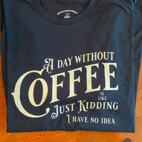 Load image into Gallery viewer, A Day Without Coffee t-shirt in navy, flat lay front view