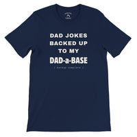 Load image into Gallery viewer, Dad-a-Base tee in navy on model, cream stacked text reading Dad Jokes Backed Up To My Dad-a-Base, funny Father's Day shirt