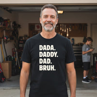 Load image into Gallery viewer, Dad wearing black Dada Daddy Dad Bruh teein his garage, casual everyday dad outfit