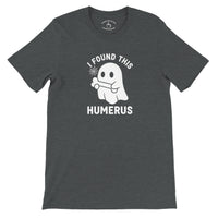 Load image into Gallery viewer, I Found This Humerus Everyday Tee in dark grey heather, flat lay showing ghost with bone graphic and collar print in grey