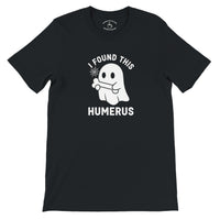 Load image into Gallery viewer, I Found This Humerus Everyday Tee in black, flat lay showing ghost with bone graphic and collar print