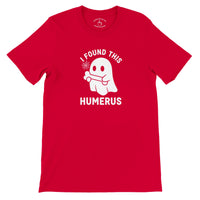 Load image into Gallery viewer, I Found This Humerus Everyday Tee in red, flat lay showing ghost with bone graphic and collar print