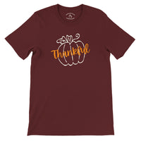 Load image into Gallery viewer, Thankful Pumpkin Everyday Tee in maroon, flat lay showing pumpkin outline with Thankful script and collar print